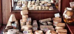 a bunch of different types of bread on a table